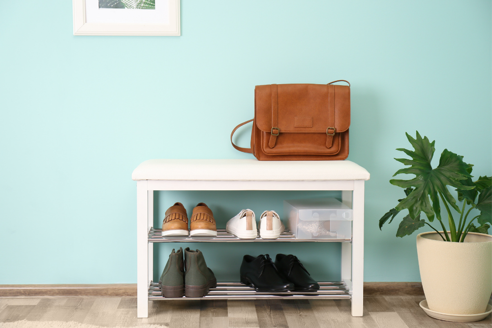 full shoe rack with leather bag on top