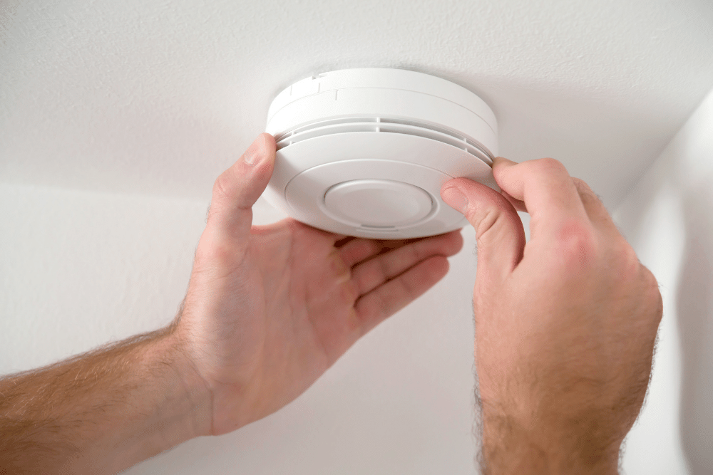 smoke alarm being fitted