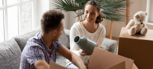 couple moving into a new house unpacking boxes
