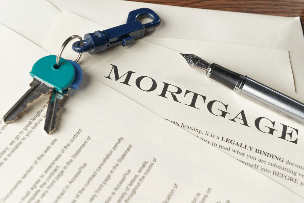 a mortgage form with keys and a pen on top