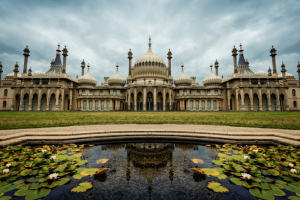 brighton pavillion with a pond in front of it