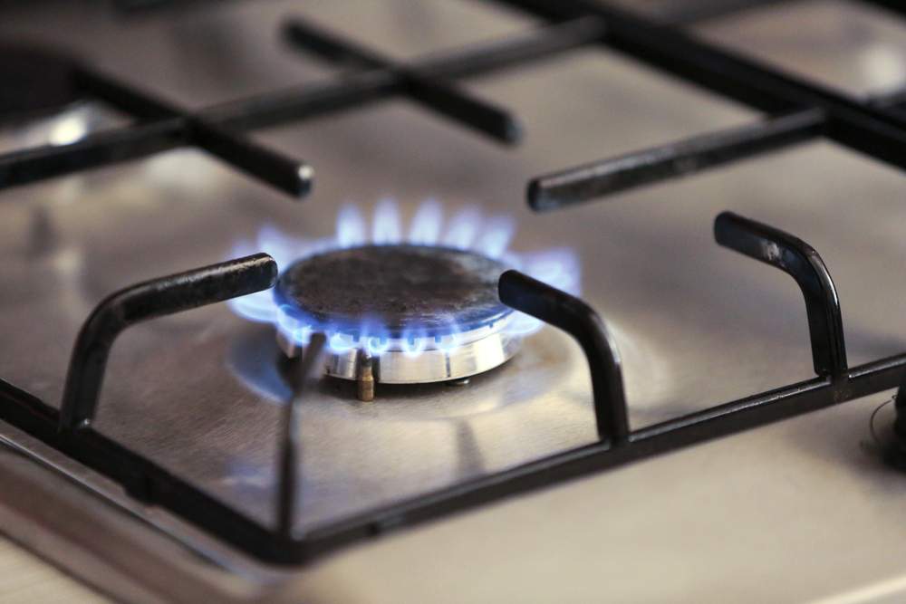 Gas hob with flame on gas cooker