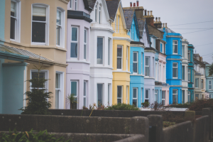 a row of colourful british terrace houses
