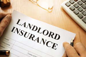 a landlord insurance form on a desk