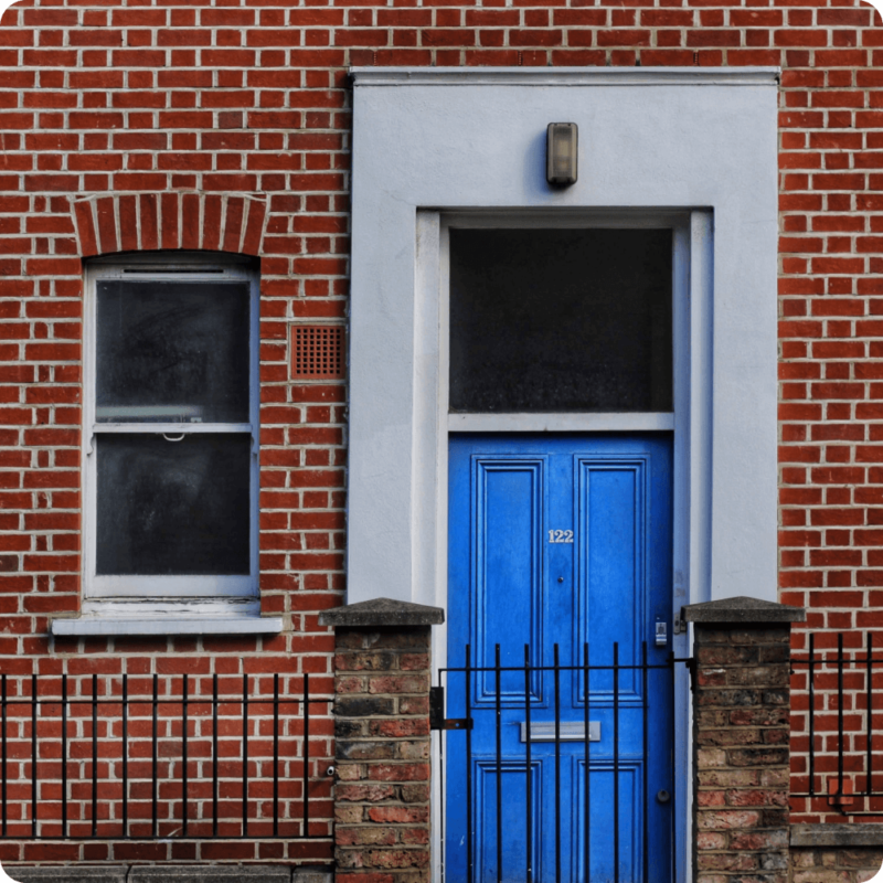 Blue door , brick building